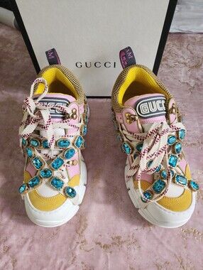 GUCCI |  Flashtrek Sneakers in a pink & gold colorway - removable blue jewels
